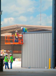 Some guttering is installed during May construction. 