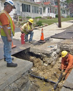 UGI workers install replacement pipe on a residential street in in Pottsville, PA.